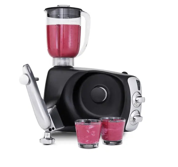 Blender with red/pink smoothie in it.