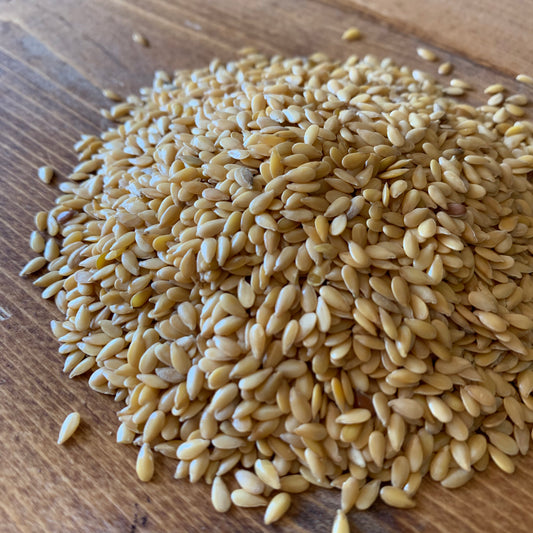 Golden Flaxseed on a brown table
