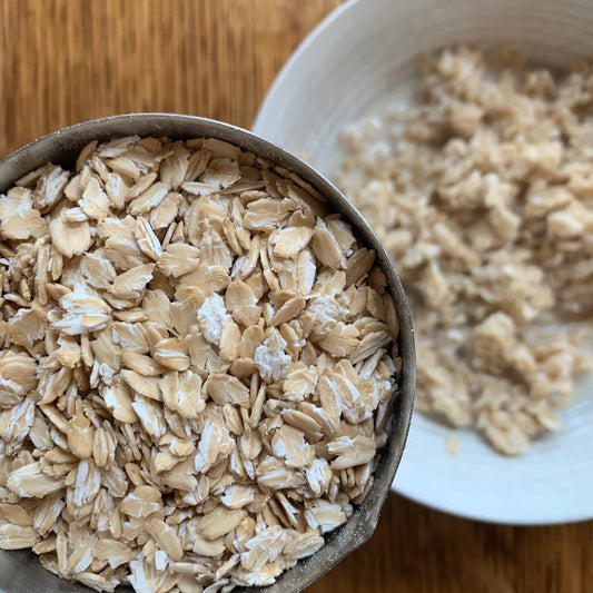 Living Sky Farm's Rolled (Flaked) Oats in measuring cup